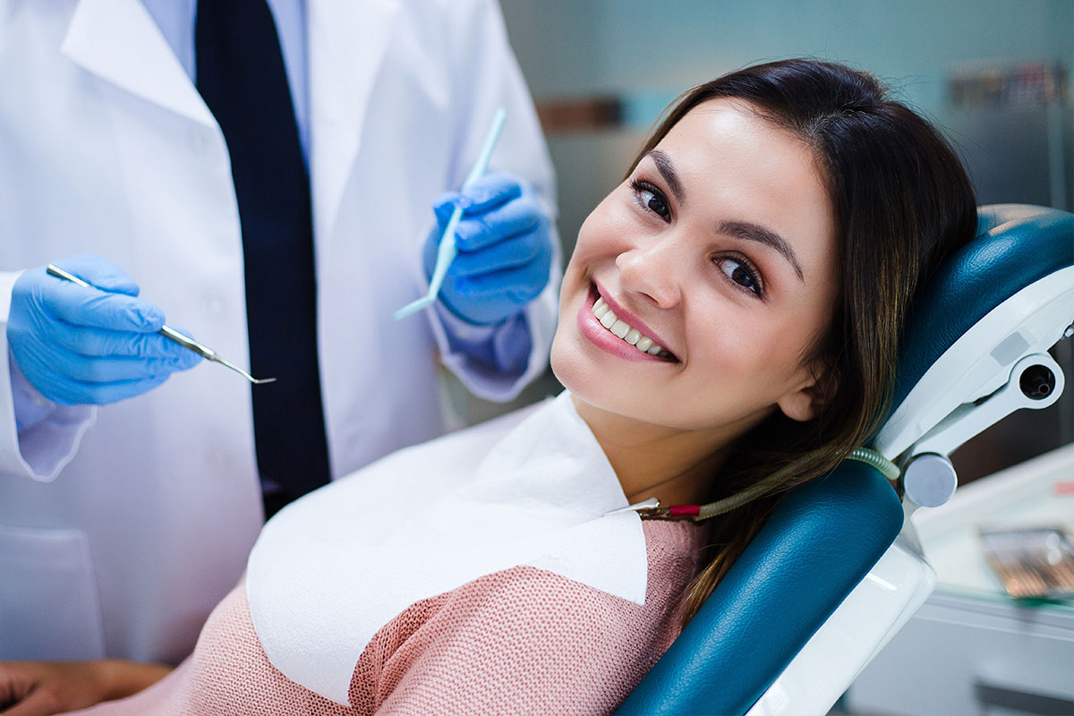 Dental-chair-smiling-girl